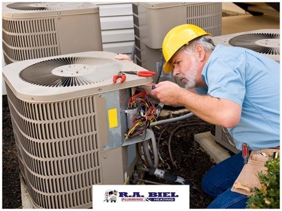 man inspecting hvac